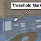 The landing threshold at Paris Charles de Gaulle Airport (LFPG). A total of 12 stripes indicates a runway that is 150 feet wide. (Google Earth)